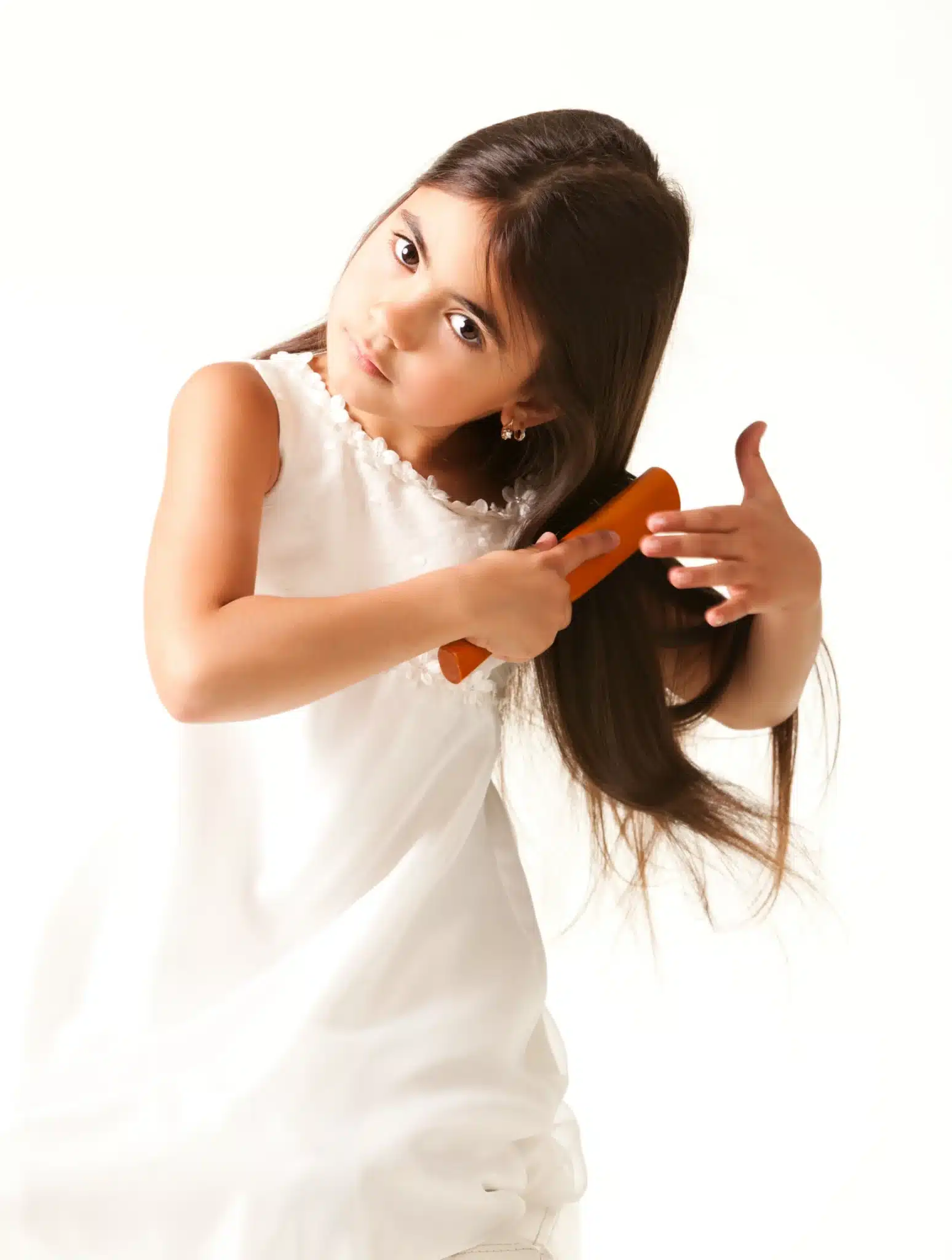 Springfield girl in white dress combing brown hair scaled